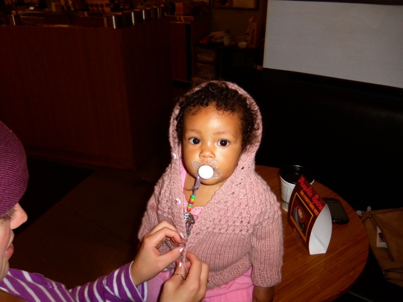 Nyah inherited that sweater from Kimmy's own infancy.